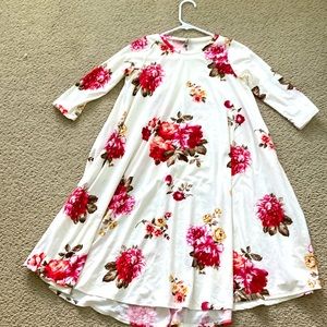Girls white flower print dress with quarter sleeves. Size large.
